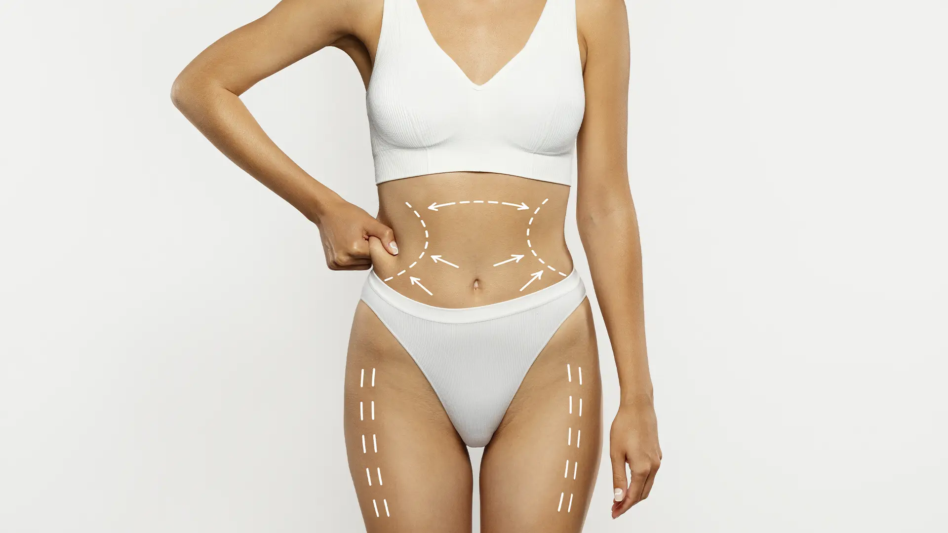 A happy, confident mother embracing her body after reaching the ideal weight for a mommy makeover.